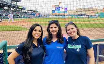 Photo of Three Women Posing At Dunkin Park